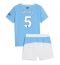 Strój piłkarski Manchester City John Stones #5 Koszulka Podstawowej dziecięce 2025-26 Krótki Rękaw (+ Krótkie spodenki)