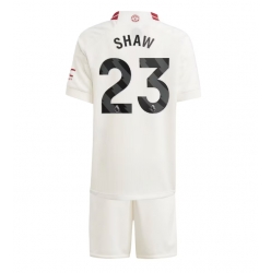 Strój piłkarski Manchester United Luke Shaw #23 Koszulka Trzeciej dziecięce 2023-24 Krótki Rękaw (+ Krótkie spodenki)